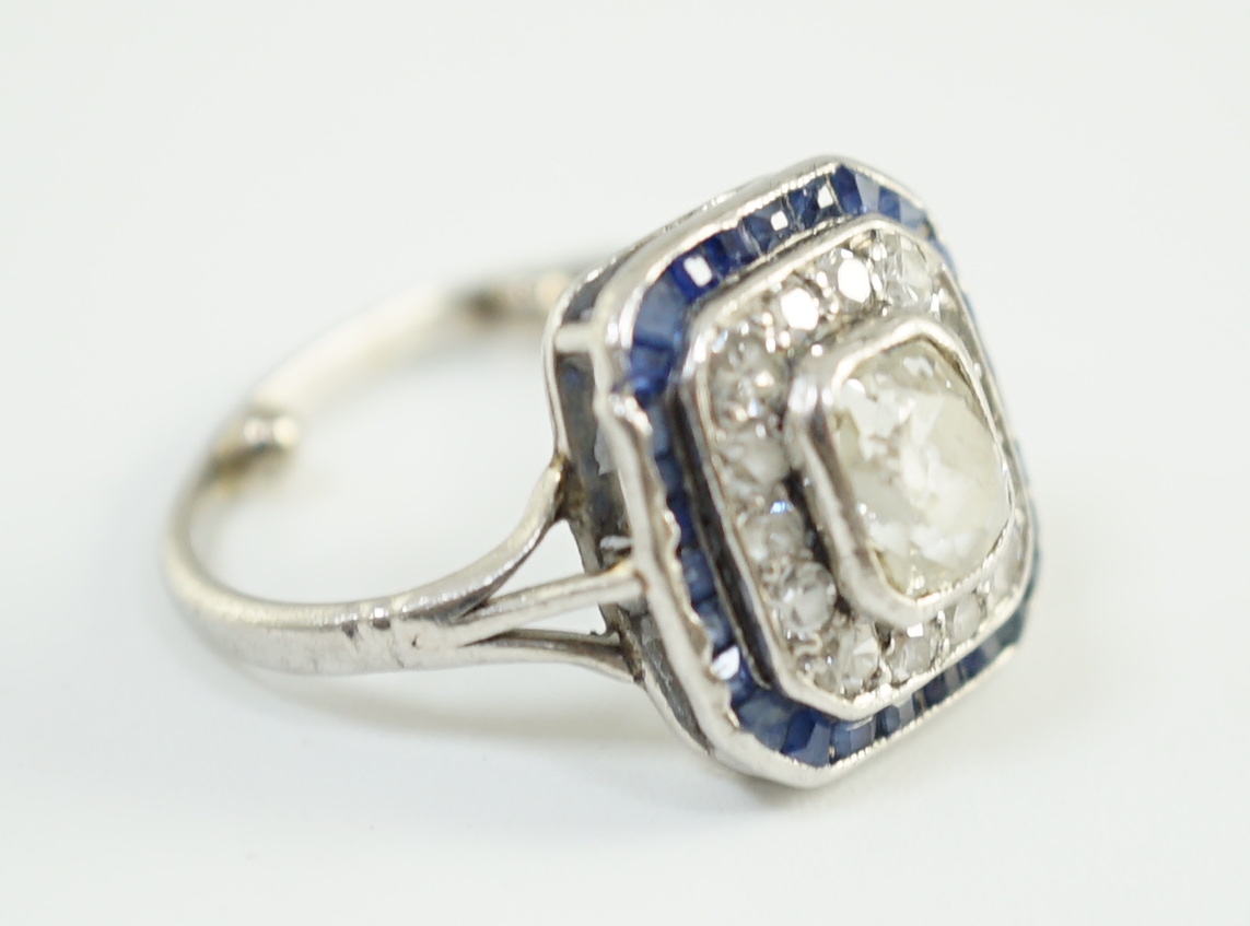 An Art Deco platinum, diamond and sapphire set rectangular cluster ring